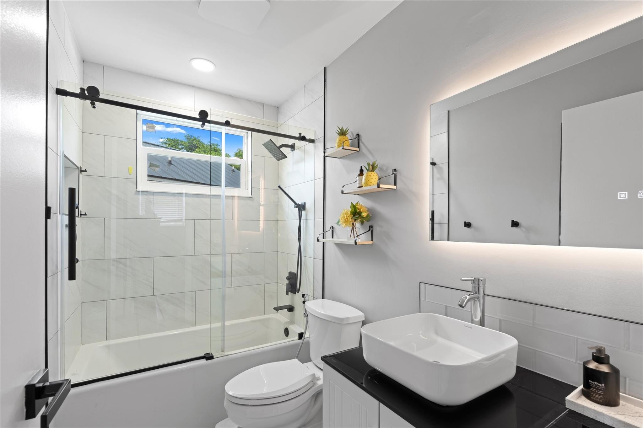 133 Southwest 159th Way Sunrise, FL 33326 - Photo 21 of 38 a bathroom with a sink toilet and shower