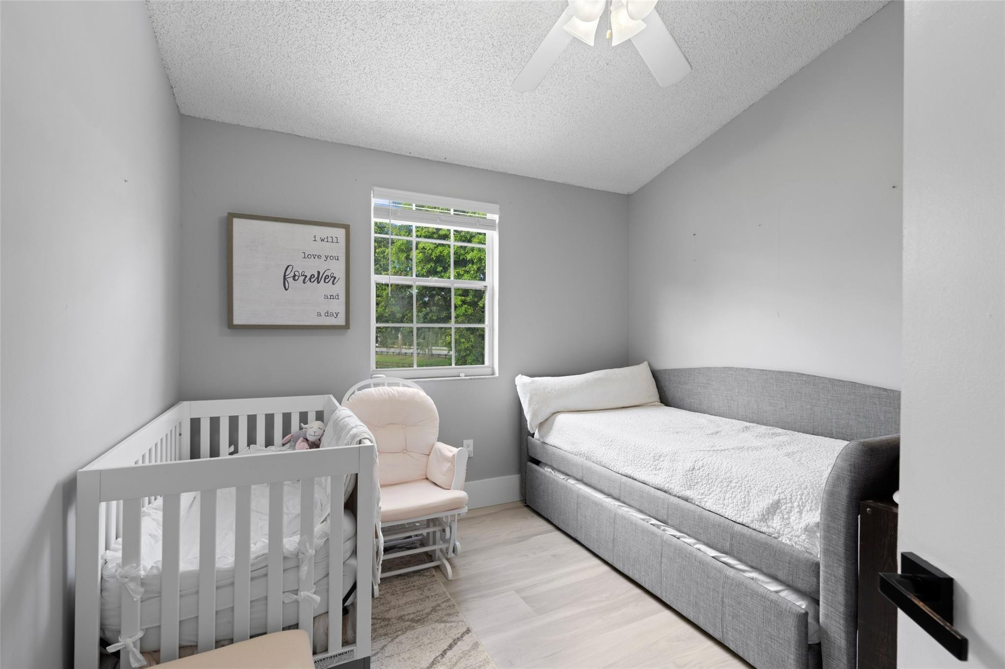 133 Southwest 159th Way Sunrise, FL 33326 - Photo 24 of 38 a bedroom with a bed and a window