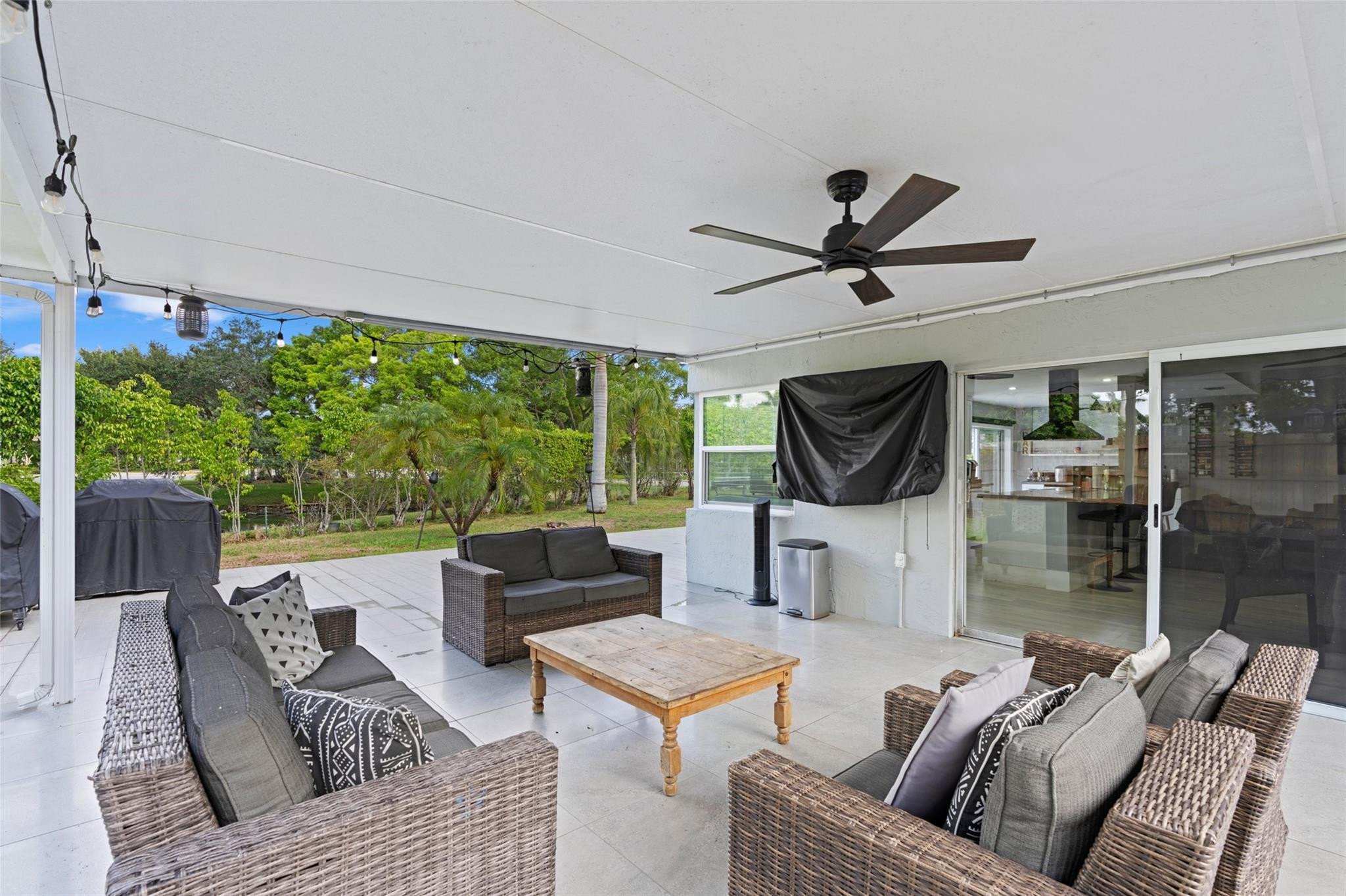 133 Southwest 159th Way Sunrise, FL 33326 - Photo 36 of 38 a living room with furniture and a flat screen tv
