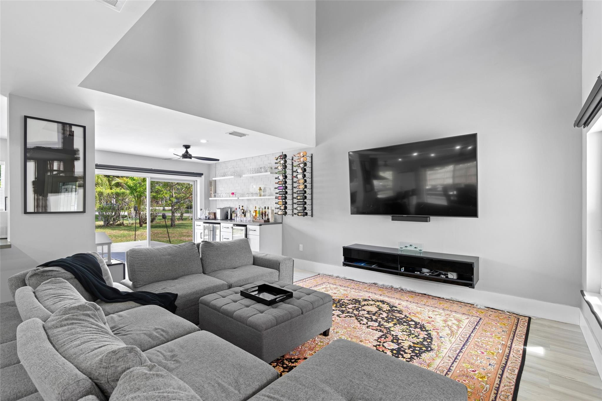 133 Southwest 159th Way Sunrise, FL 33326 - Photo 4 of 38 a living room with furniture and a flat screen tv