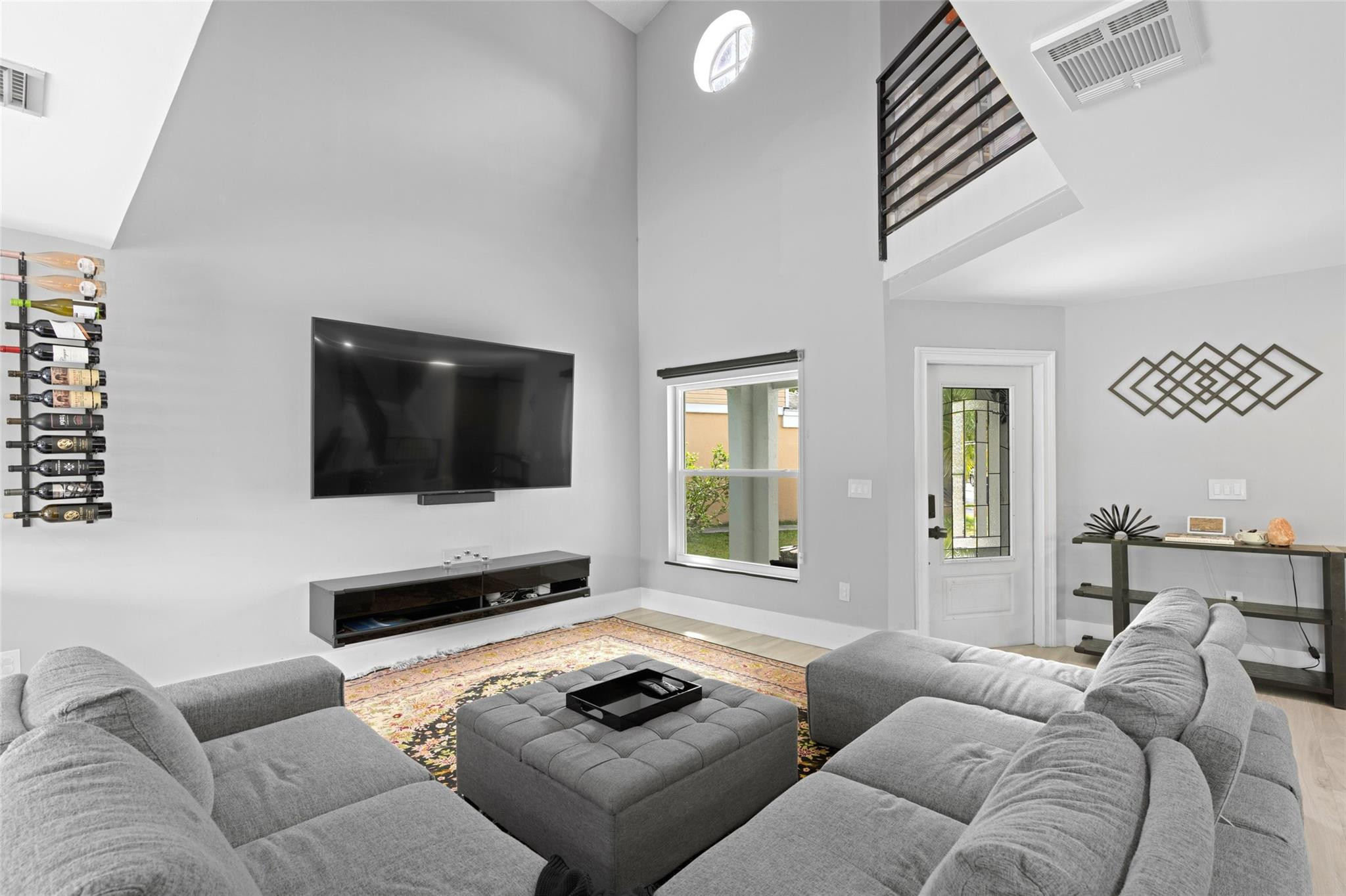 133 Southwest 159th Way Sunrise, FL 33326 - Photo 5 of 38 a living room with furniture and a flat screen tv