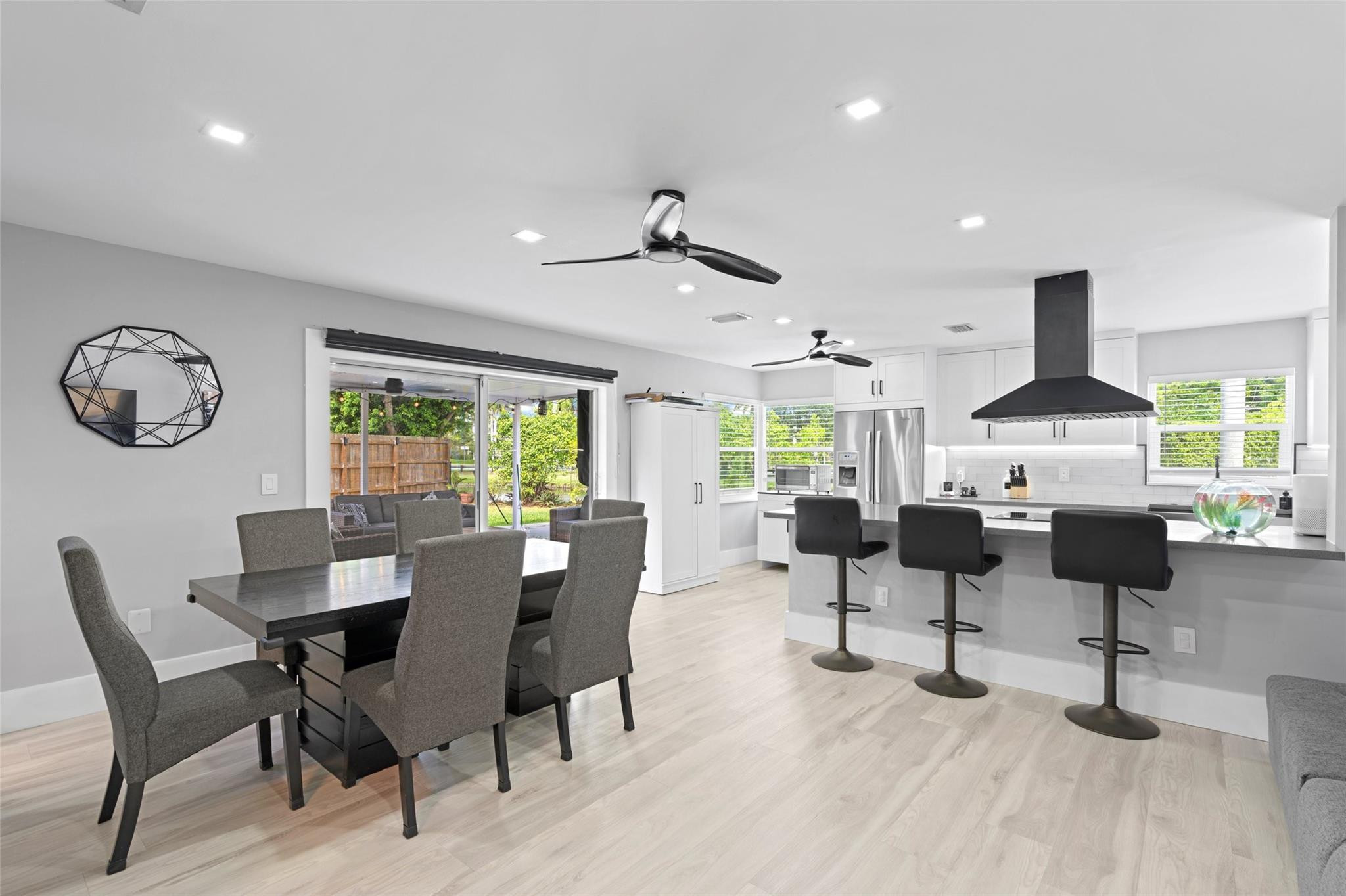 133 Southwest 159th Way Sunrise, FL 33326 - Photo 9 of 38 a view of a dining room with furniture a rug and wooden floor