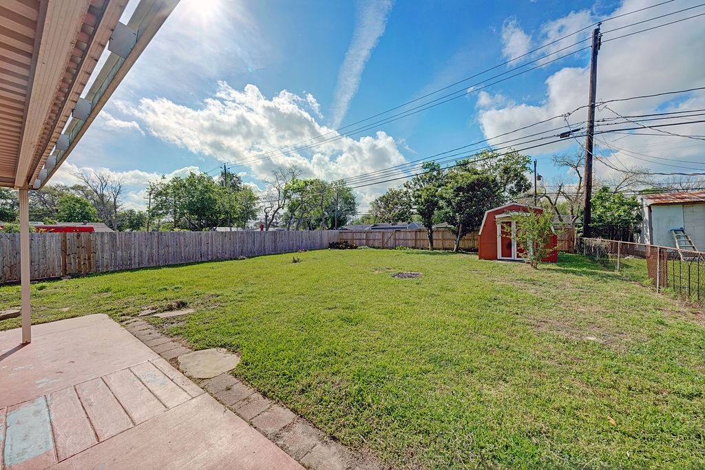 614 Gilpin Street Houston, TX 77034 - Photo 21 of 27 The home comes with the perfect solution for your outdoor organization needs with this charming storage building, ideal for neatly housing all your yard tools.