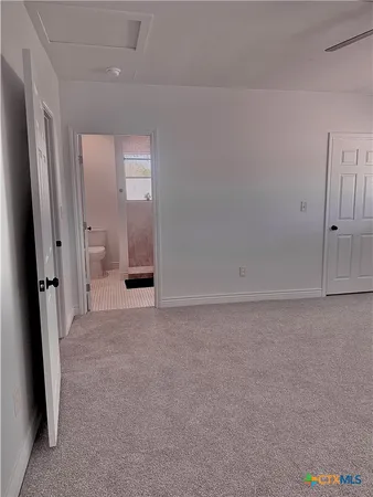 a view of an empty room and window