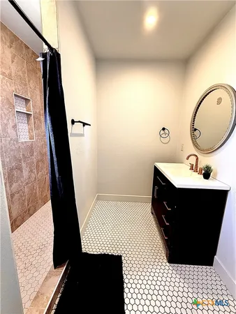 a bathroom with a sink and a mirror