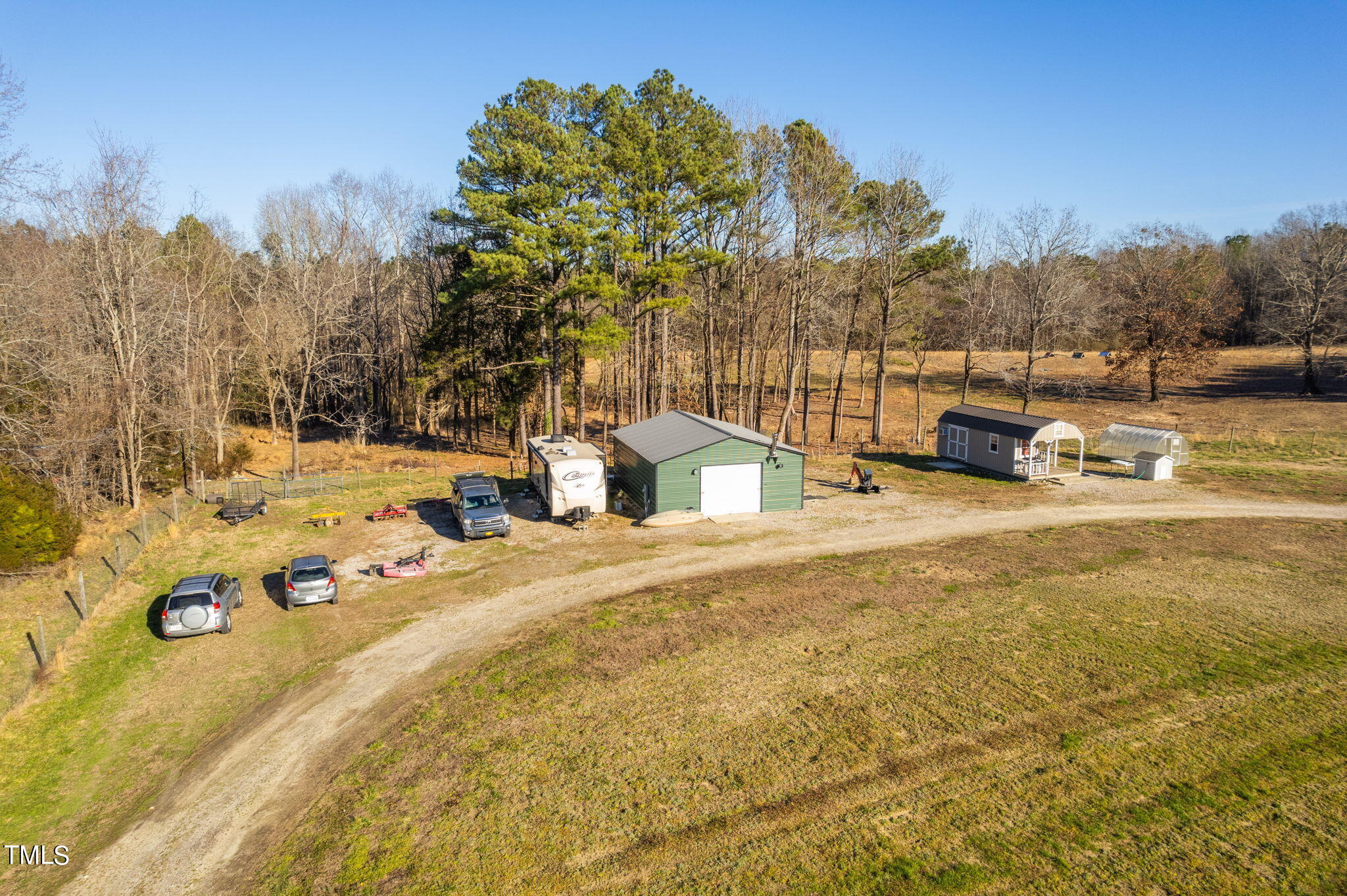 1428 Spring Valley Lake Road Henderson, NC 27537 - Photo 37 of 92 left view of workshop and storage shed
