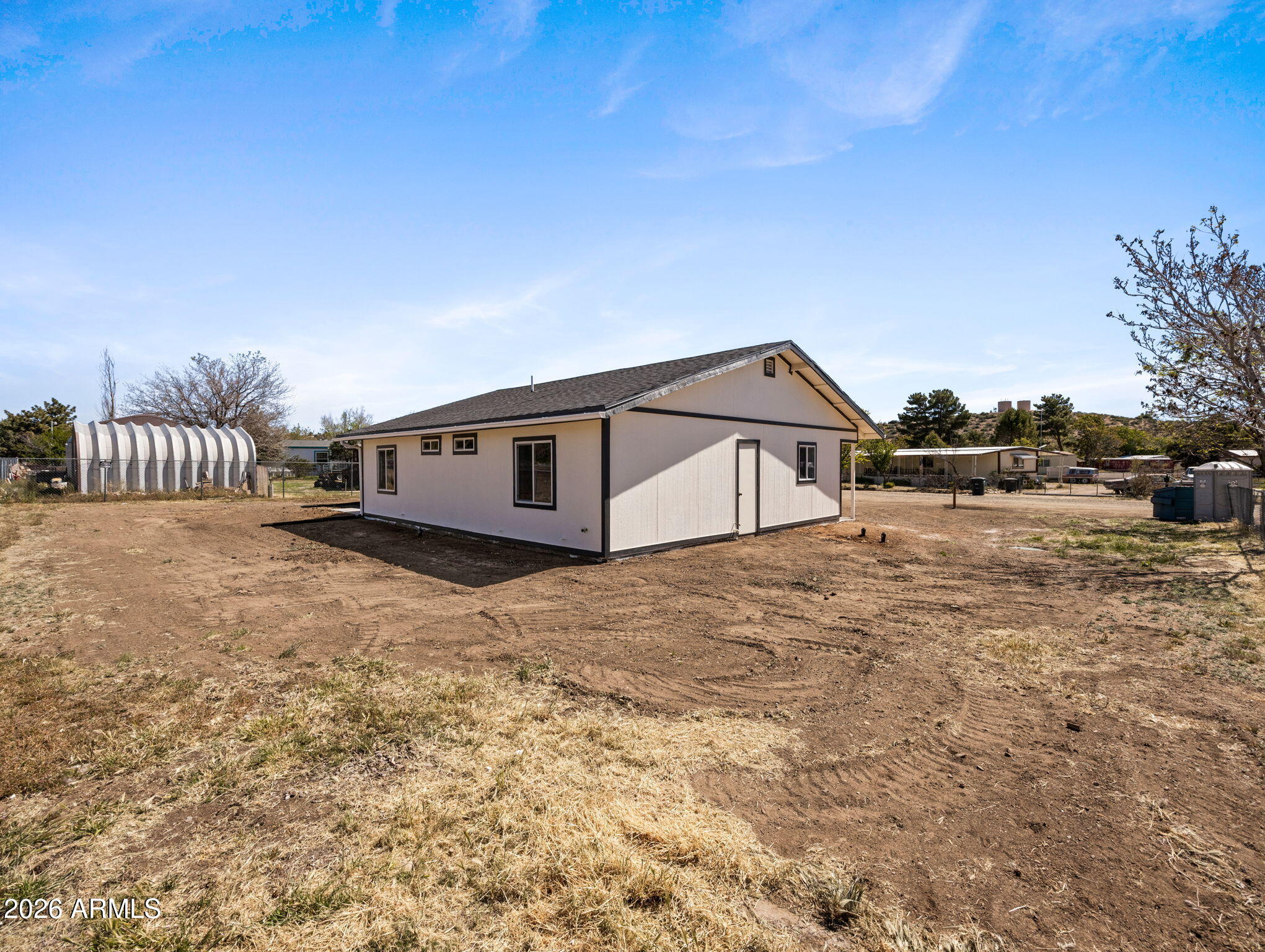 18278 Frontier Road Peeples Valley, AZ 86332 - Photo 30 of 31 a house view with a backyard space