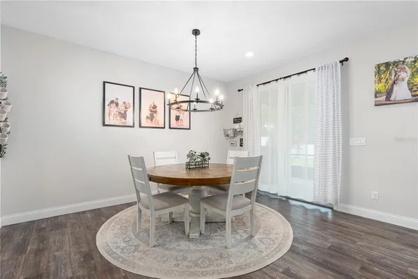 a room with furniture a flat screen tv and a book shelf