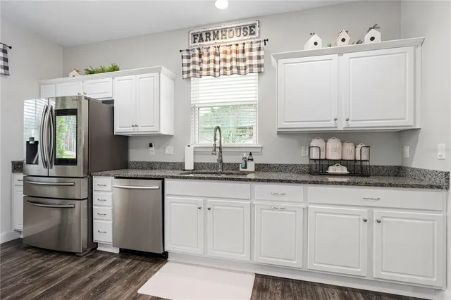 a bedroom with a bed rug and window