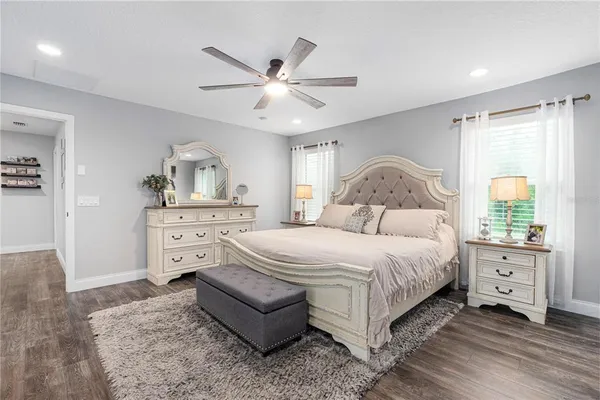 a bedroom with bed and a window