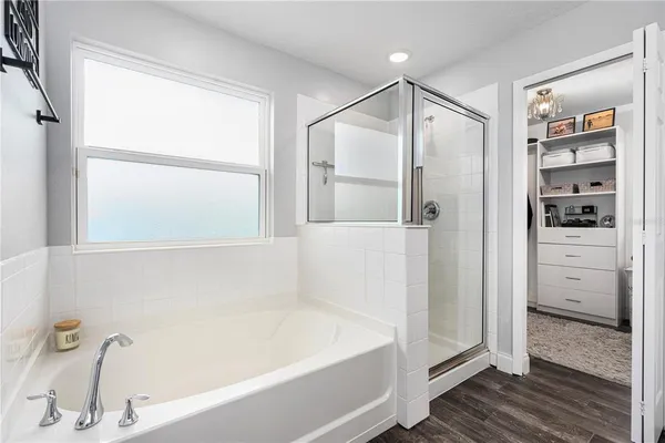 a bathroom with a granite countertop double vanity sink a mirror and a toilet