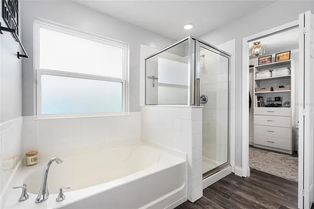 a bathroom with a granite countertop double vanity sink a mirror and a toilet