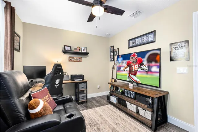 an aerial view of a house with a yard