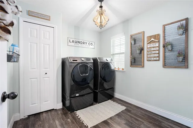 a green field with lots of trees