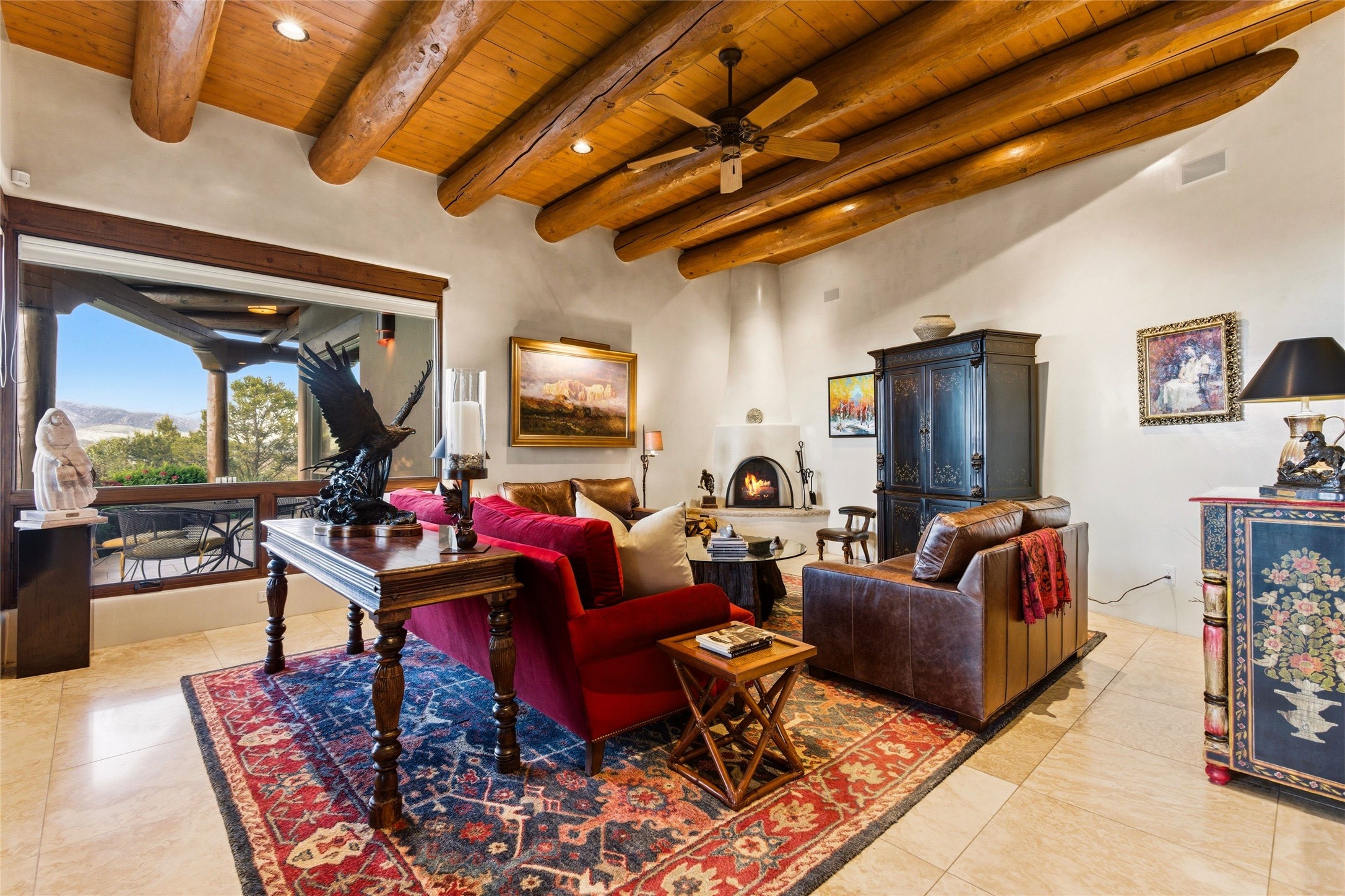 42 San Juan Ranch Road Santa Fe, NM 87506 - Photo 18 of 49 Family Room with Kiva Fireplace and its own access to outdoor Living Areas