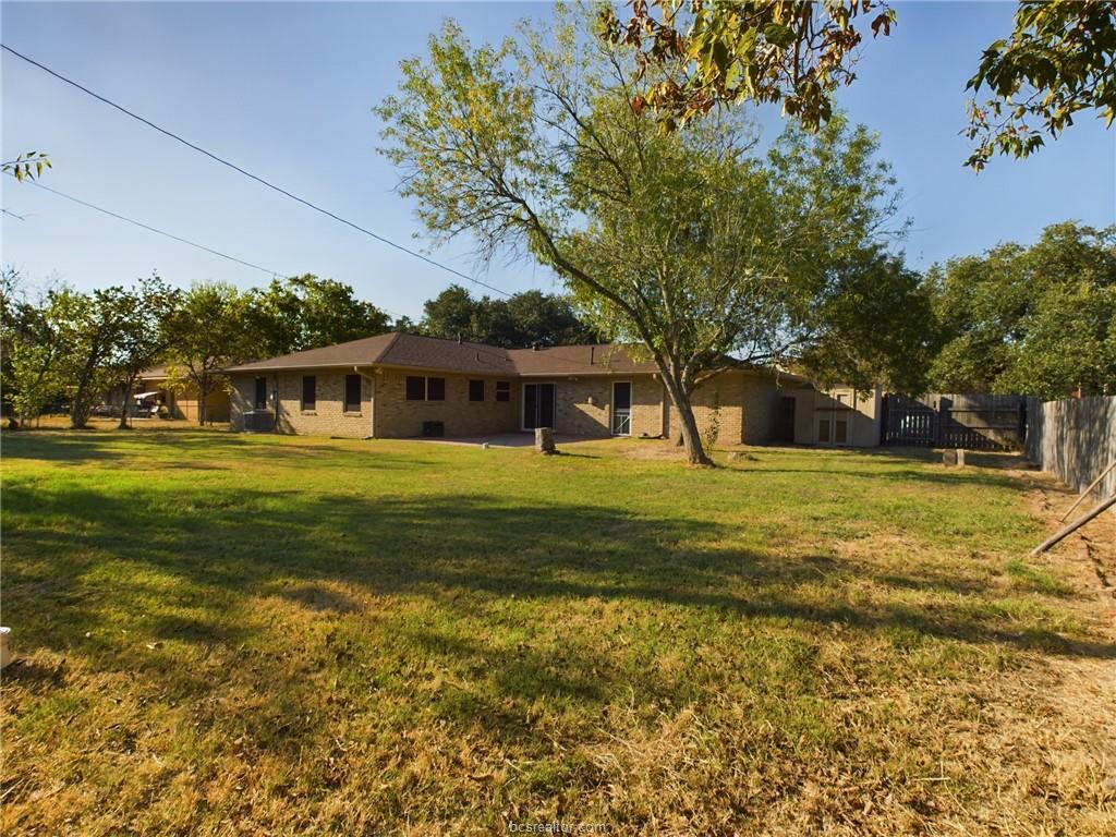 1504 East 29th Street Bryan, TX 77802 - Photo 17 of 19 a view of a house with a big yard