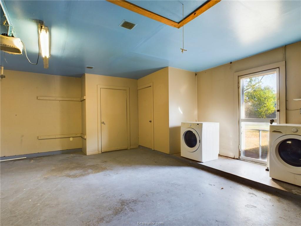 1504 East 29th Street Bryan, TX 77802 - Photo 18 of 19 a view of an empty room with a fireplace and a window