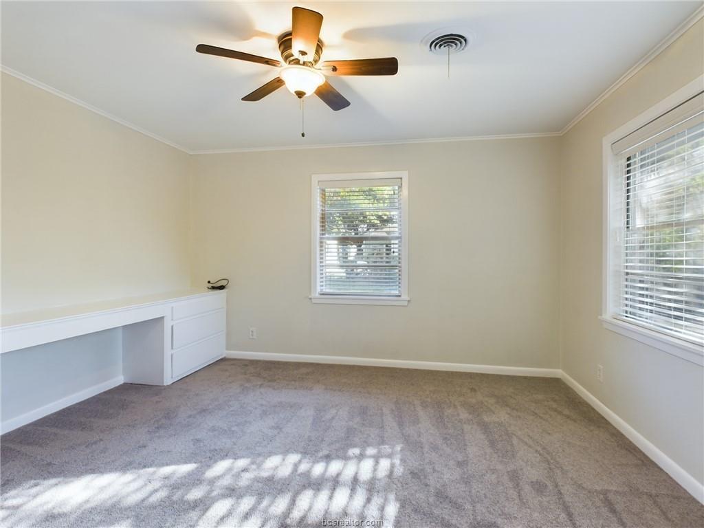 1504 East 29th Street Bryan, TX 77802 - Photo 7 of 19 a view of room with a ceiling fan and window