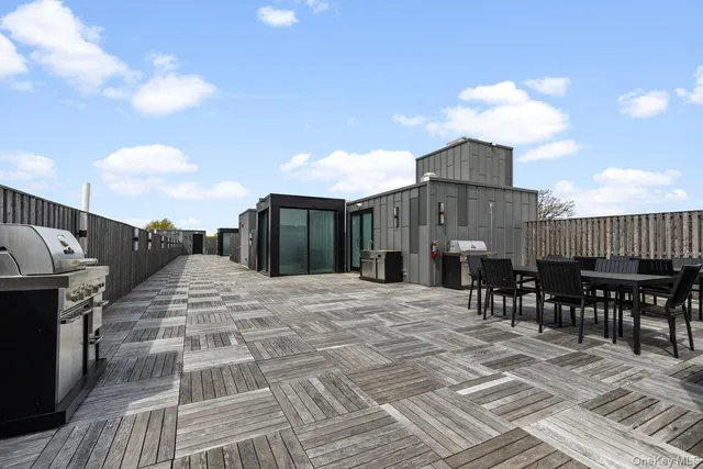 a view of a terrace with dining space