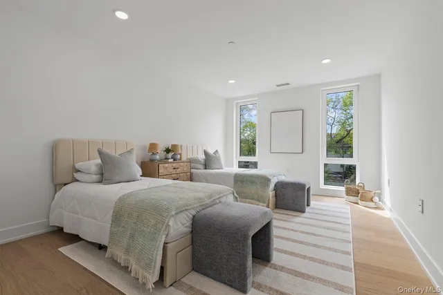 a bedroom with a large bed and a couch