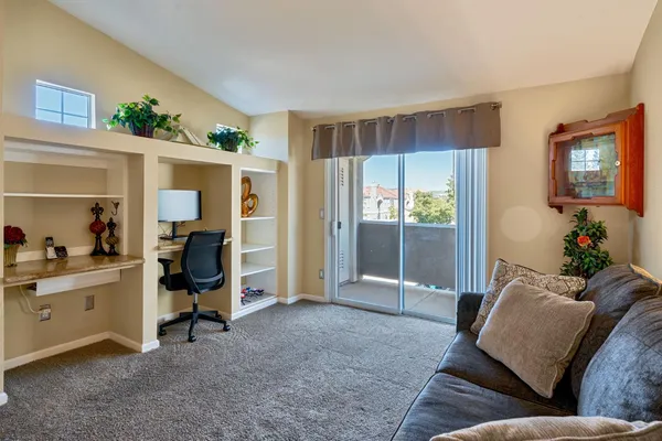 a living room with furniture and a window