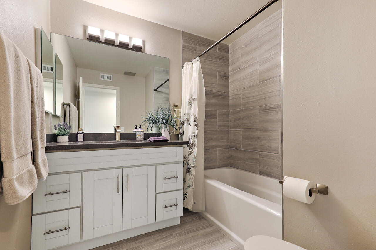36 Sunrise Drive Rancho Mirage, CA 92270 - Photo 11 of 39 a bathroom with a bathtub a double vanity sink and mirror