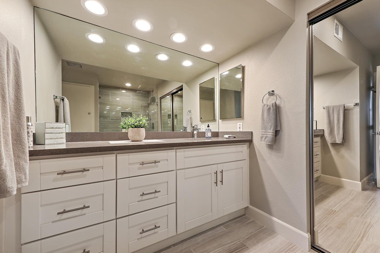 36 Sunrise Drive Rancho Mirage, CA 92270 - Photo 13 of 39 a bathroom with a double vanity sink a mirror and a shower