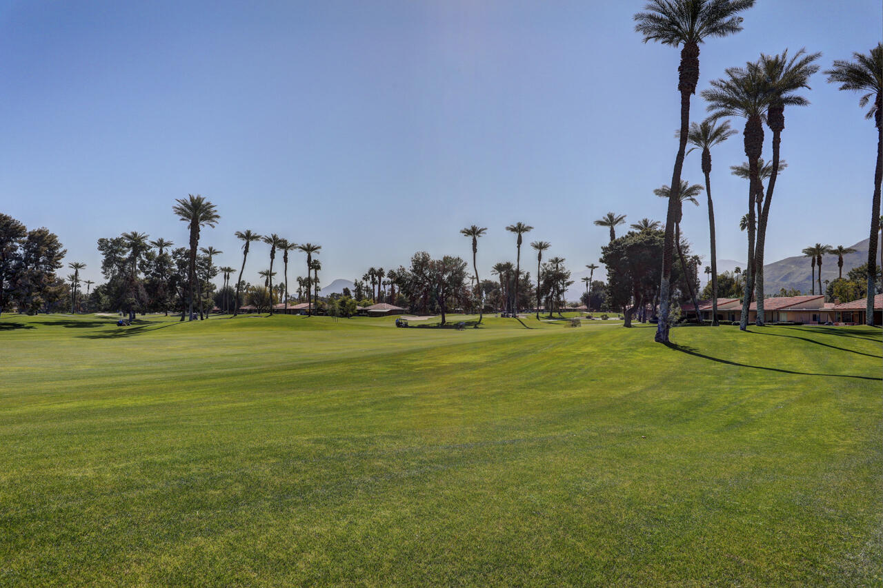 36 Sunrise Drive Rancho Mirage, CA 92270 - Photo 21 of 39 a view of yard with swimming pool and trees