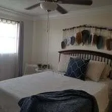 a bedroom with a bed and window