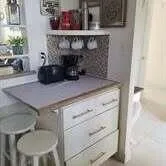 a kitchen with a stove and cabinets
