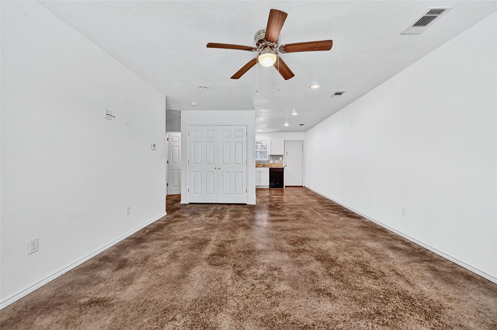 712 Seven Oaks Road, Unit 712 Bonham, TX 75418 - Photo 12 of 39 a view of empty room with wooden floor and ceiling fan