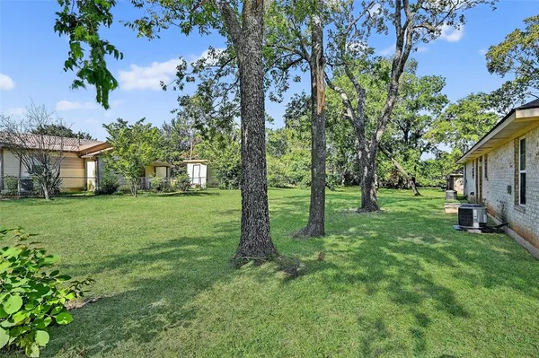 a view of backyard with green space