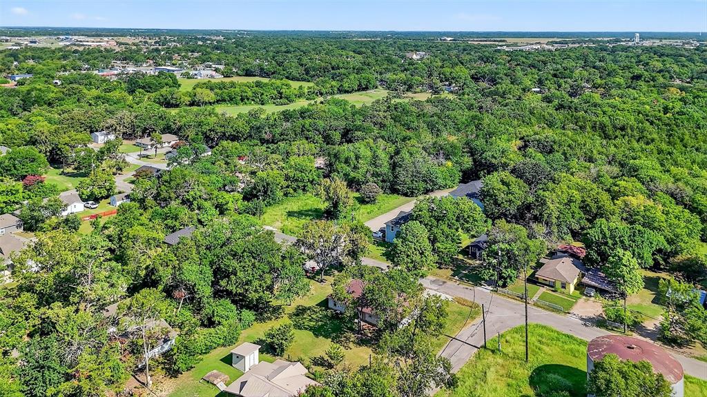 712 Seven Oaks Road, Unit 712 Bonham, TX 75418 - Photo 31 of 39 a view of a lush green forest with lots of trees