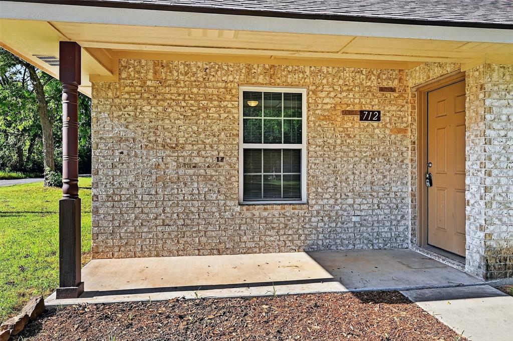 712 Seven Oaks Road, Unit 712 Bonham, TX 75418 - Photo 7 of 39 a view of a door and a window