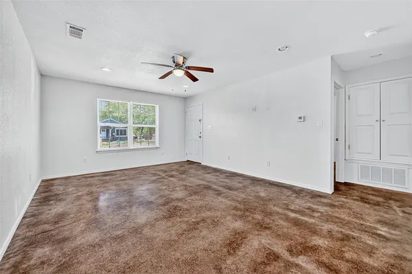 a view of an empty room with a window