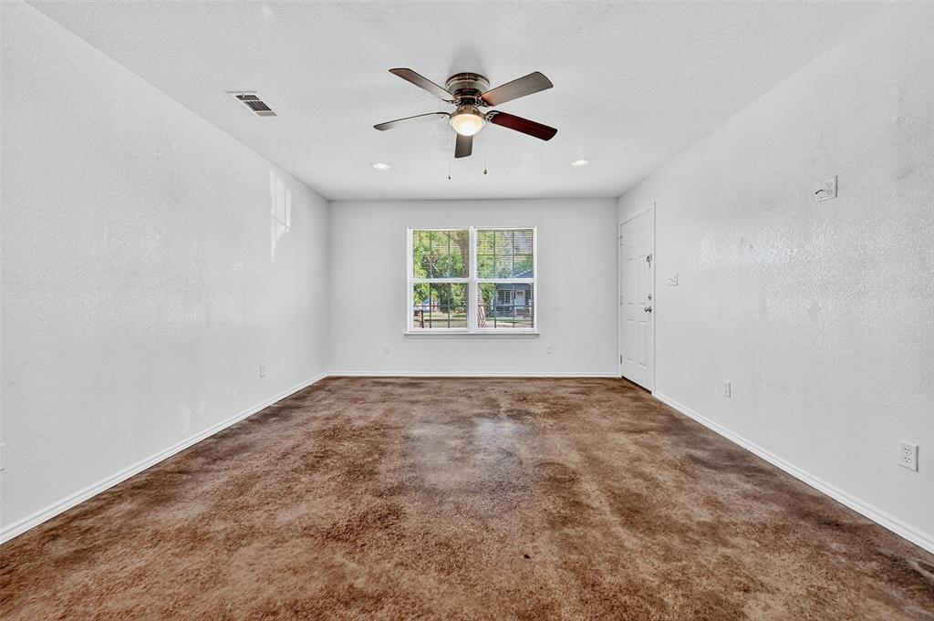 712 Seven Oaks Road, Unit 712 Bonham, TX 75418 - Photo 10 of 39 an empty room with window and ceiling fan