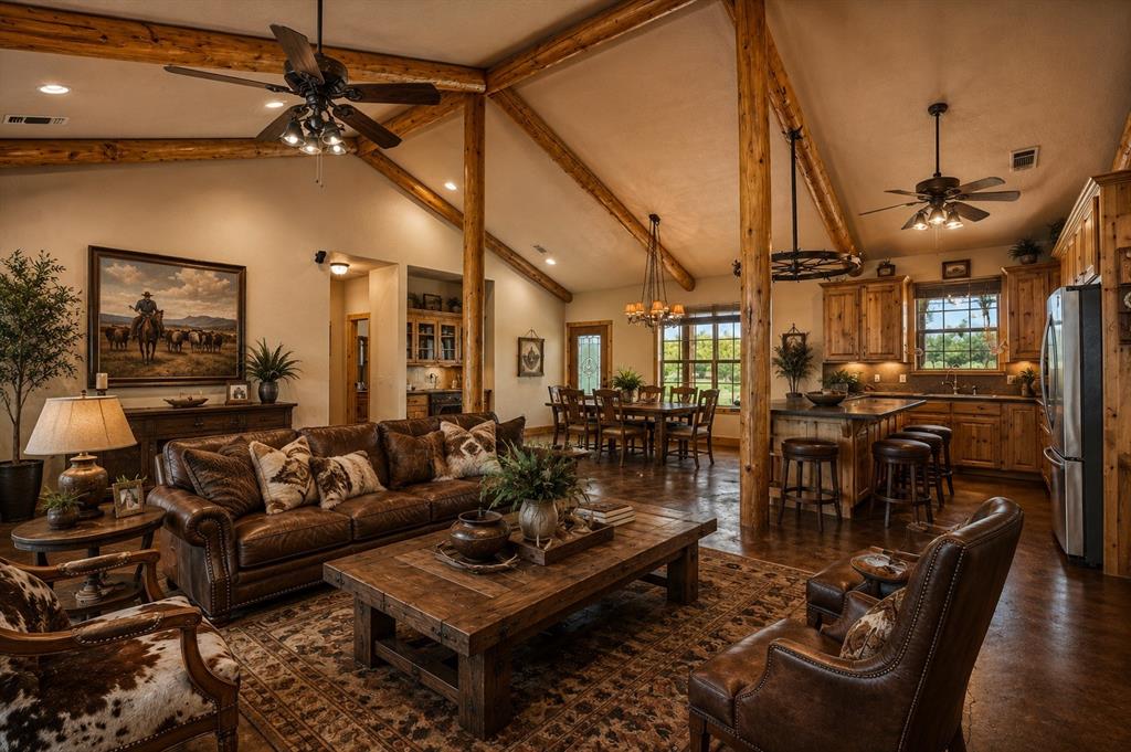 243 ROCK Court Decatur, TX 76234 - Photo 5 of 28 a living room with lots of furniture and a chandelier