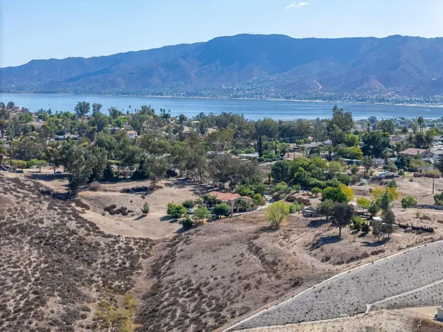 a view of a table and chairs on the side of the road