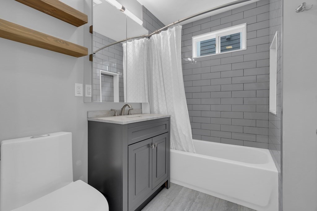 29 Walton Street, Unit 2 Boston, MA 02124 - Photo 13 of 21 a bathroom with a sink toilet and shower