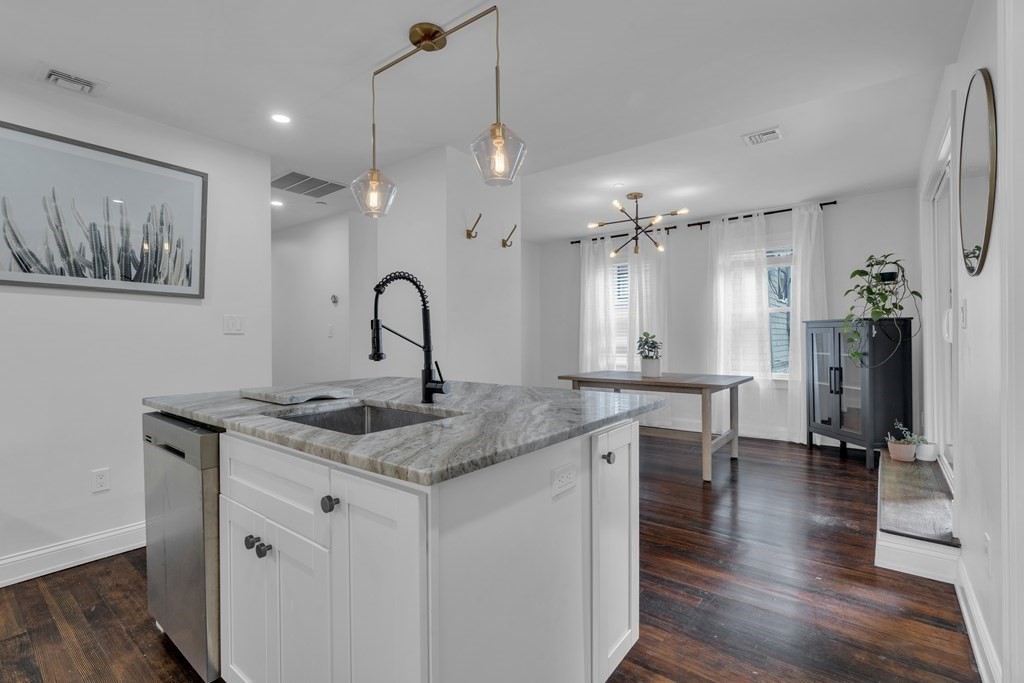 29 Walton Street, Unit 2 Boston, MA 02124 - Photo 4 of 21 a kitchen with a sink chandelier and wooden floor