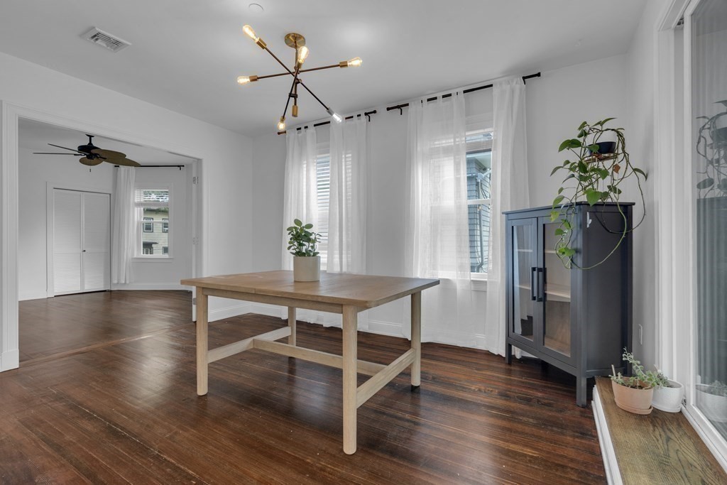 29 Walton Street, Unit 2 Boston, MA 02124 - Photo 6 of 21 a view of a dining room with furniture window and wooden floor