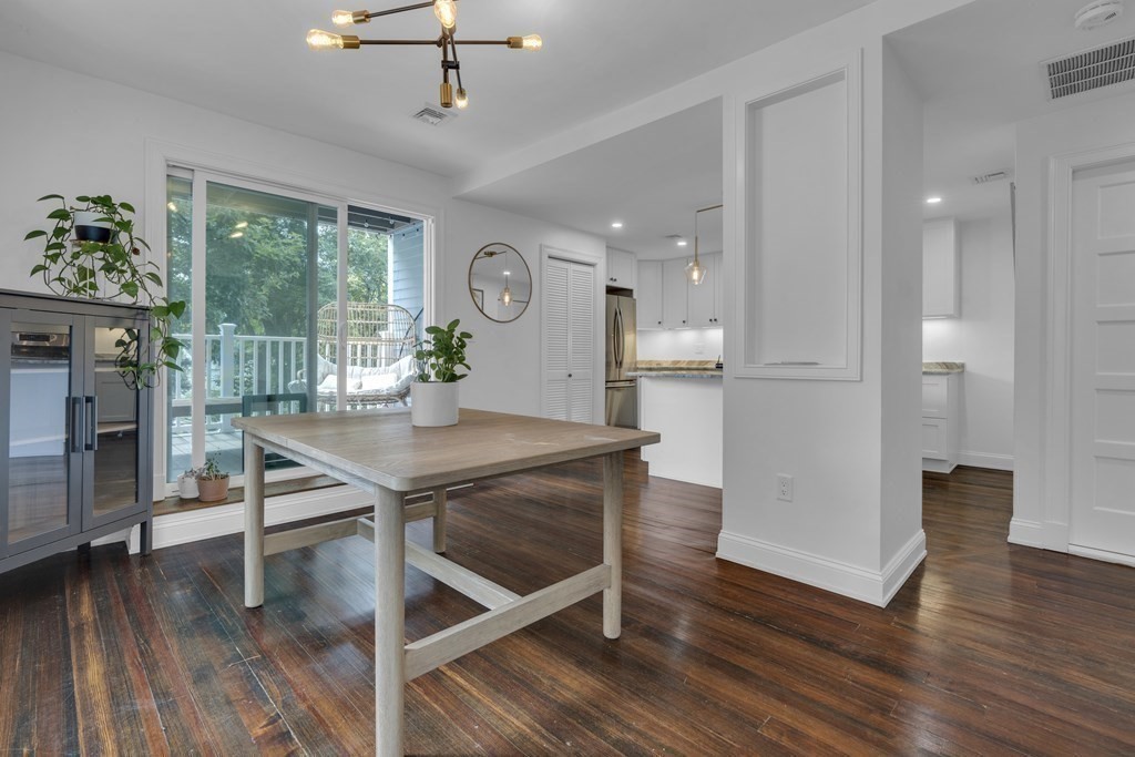 29 Walton Street, Unit 2 Boston, MA 02124 - Photo 7 of 21 a view of a dining room with furniture window and wooden floor