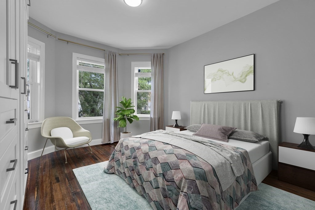 29 Walton Street, Unit 2 Boston, MA 02124 - Photo 8 of 21 a bedroom with a bed and a large window