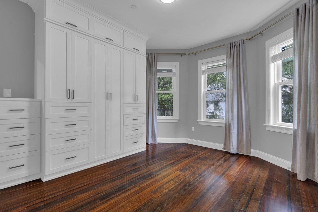 29 Walton Street, Unit 2 Boston, MA 02124 - Photo 9 of 21 a view of wooden floor and windows in a room