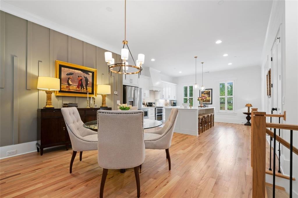 1045 Endeavour Court Marietta, GA 30064 - Photo 11 of 39 a view of a dining room and livingroom with furniture wooden floor a chandelier