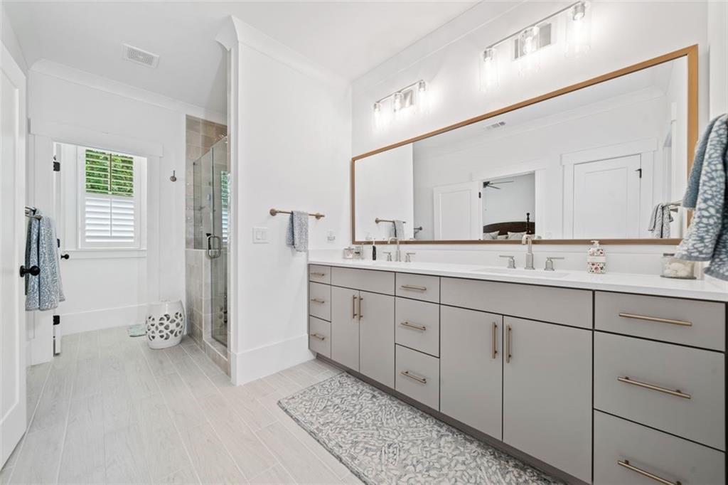 1045 Endeavour Court Marietta, GA 30064 - Photo 19 of 39 a spacious bathroom with double sink and a mirror