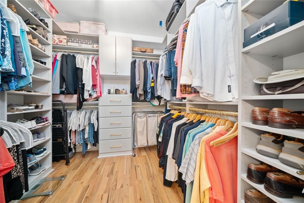 1045 Endeavour Court Marietta, GA 30064 - Photo 22 of 39 a view of walk in closet with clothes and shoes