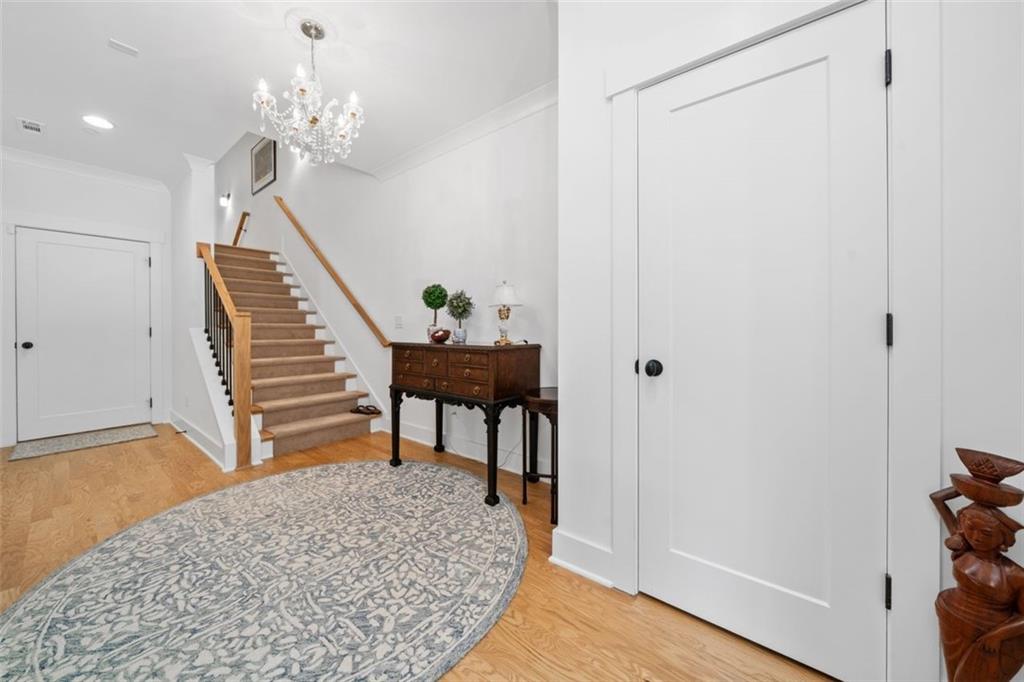 1045 Endeavour Court Marietta, GA 30064 - Photo 29 of 39 a view of a hallway with wooden floor and staircase