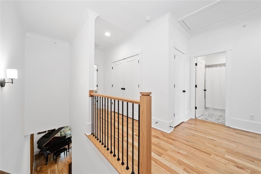 1045 Endeavour Court Marietta, GA 30064 - Photo 30 of 39 a view of a hallway with wooden floor and staircase