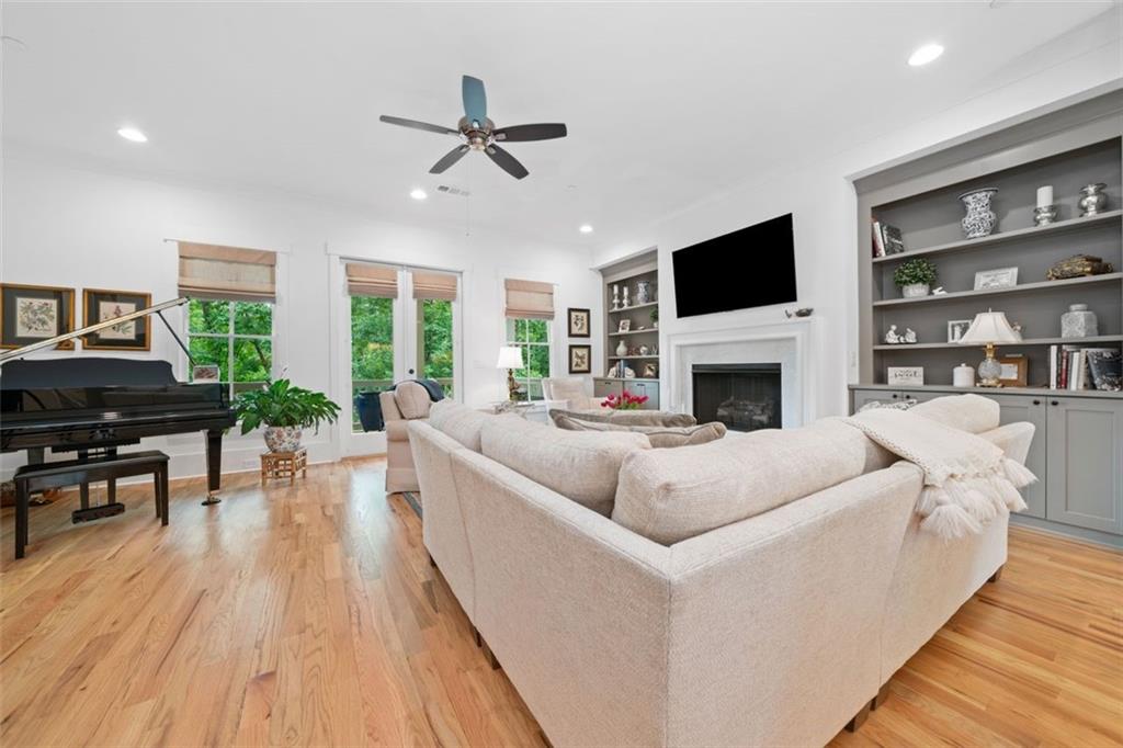 1045 Endeavour Court Marietta, GA 30064 - Photo 4 of 39 a living room with furniture fireplace and a flat screen tv